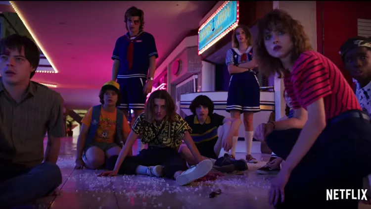 Screenshot of Stranger Things, starring Winona Ryder, David Harbour, Finn Wolfhard, and Millie Bobby Brown.