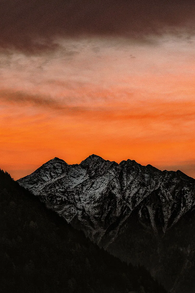 Alpenglow is the light of the setting or rising sun seen illuminating high mountains or the underside of clouds.
