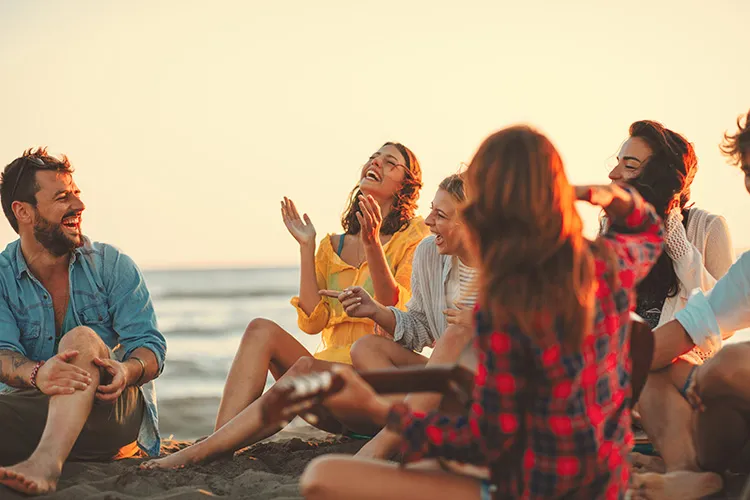 friends laughing at the beach