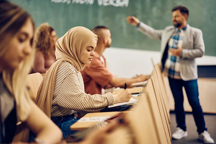 female student takes notes