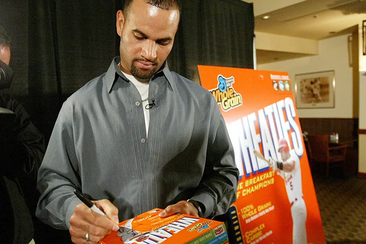 Baseball player signing a wheaties box