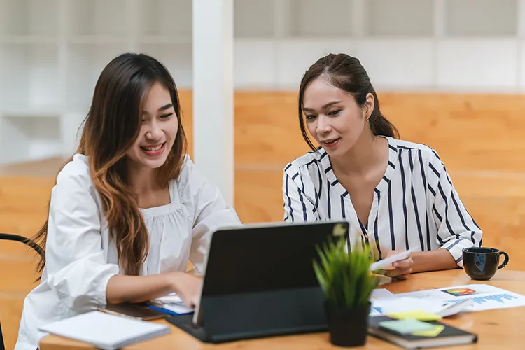 Two people working together on a dissertation
