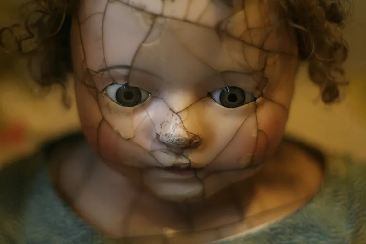 Doll with a cracked face