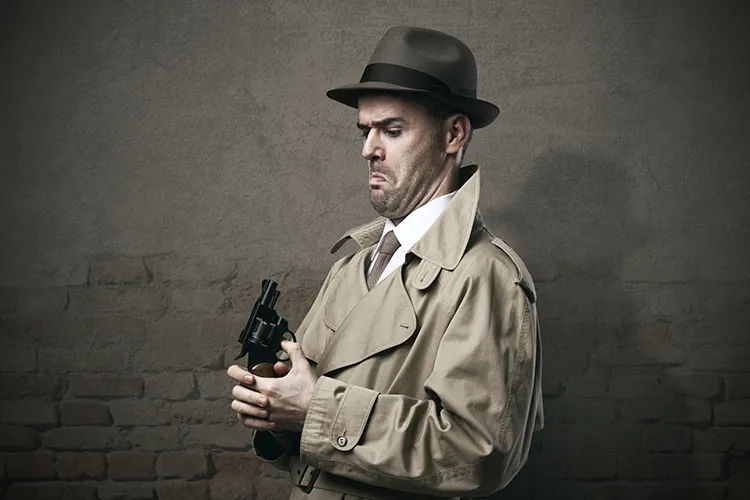 A detective mishandeling his gun