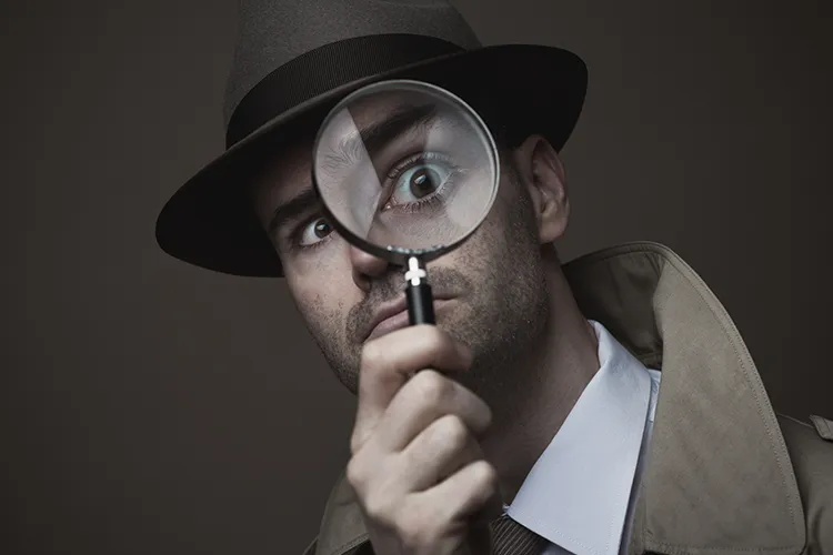 A bumbling detective with a magnifying glass