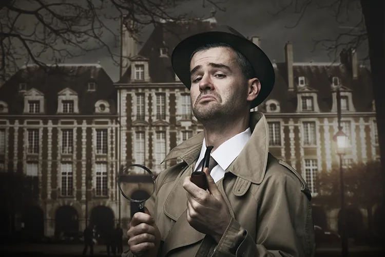 A detective in front of a mansion
