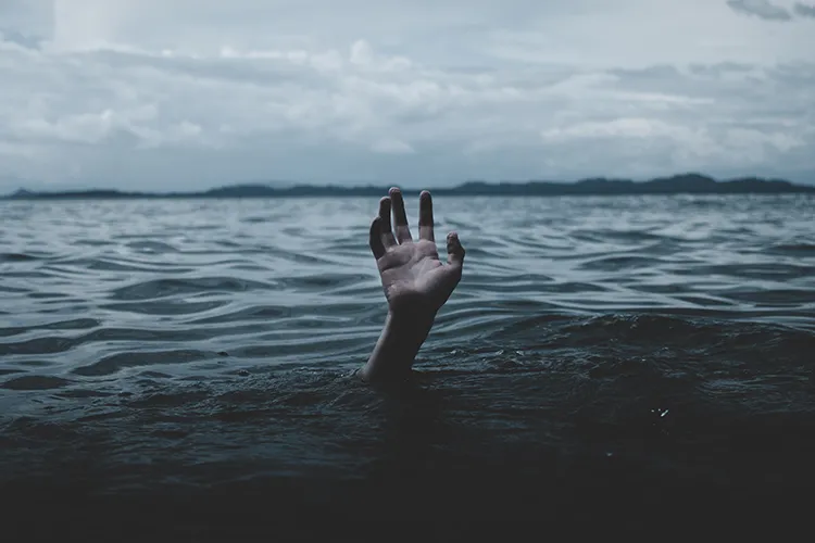 A person drowns underwater